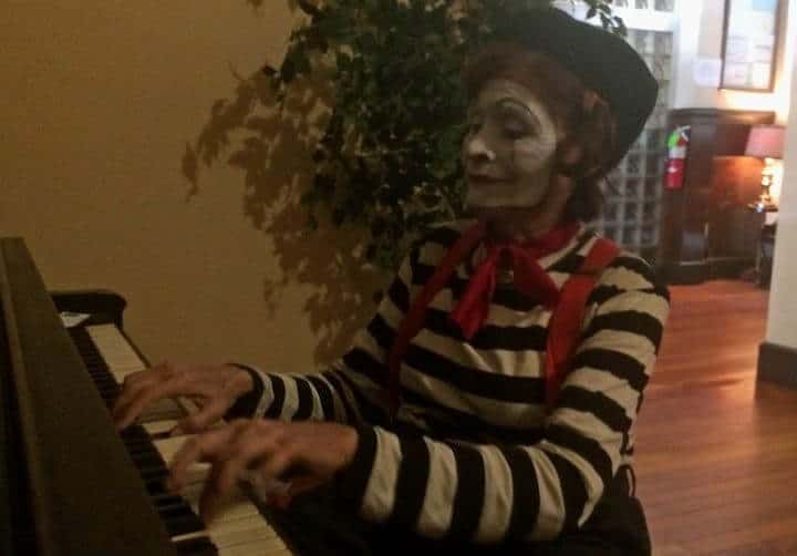 [CREDIT: Rob Borkowski} Amy the Mime played piano for passers-by inside The Greenwich Hotel & Lounge during Thursday's Music on Main Stroll in East Greenwich. 