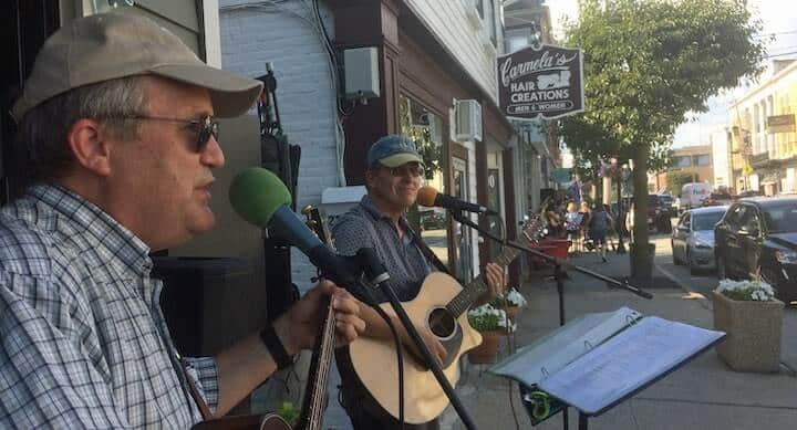 [CREDIT: Rob Borkowski} Bill Wray and Gary Blier perform outside The Revival restaurant during Thursday's Music on Main Stroll in East Greenwich.