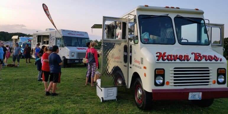 [CREDIT: Rob Borkowski] Food trucks served hungry families At Movies in the Park, showing Spider-Man: Into the Spiderverse July 25 at Rocky Point Park.