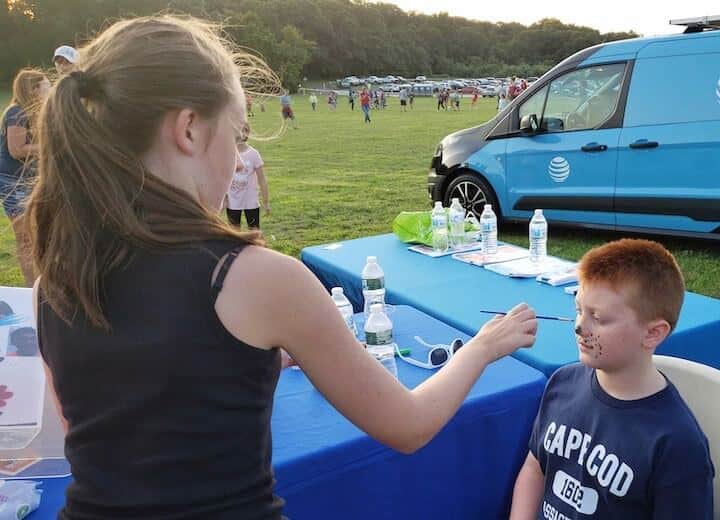 [CREDIT: Rob Borkowski] At Movies in the Park, showing Spider-Man: Into the Spiderverse July 25 at Rocky Point Park, Landon, 9, gets his face painted. His aunt, Laurie, watched nearby.