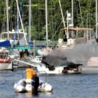 [CREDIT: Lincoln Smith] Marine 4 extinguishes a boat fire Saturday at the Fair Winds Marina.