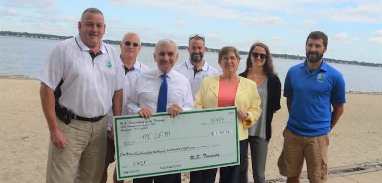 [CREDIT: Sen. Jack Reed's Office] U.S. Sen. Jack Reed and Megan DiPrete, DEM Chief, Planning & Development, at Goddard Park Monday, holding a giant check for $1.7M in federal funds for RI parks and public spaces. The two joined other state officials Sept. 16  to announce the funding.