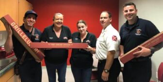 [CREDIT: D'Angelo Sandwiches] Staff and Fire Chief Peter McMichael at Warwick's Fire Station 4, with D’Angelo employees D’Angelo employees Michelle Bianchi and Ashley Quinn , on Sunday. D'Angelo delivered free sandwiches to the station Sept. 29.