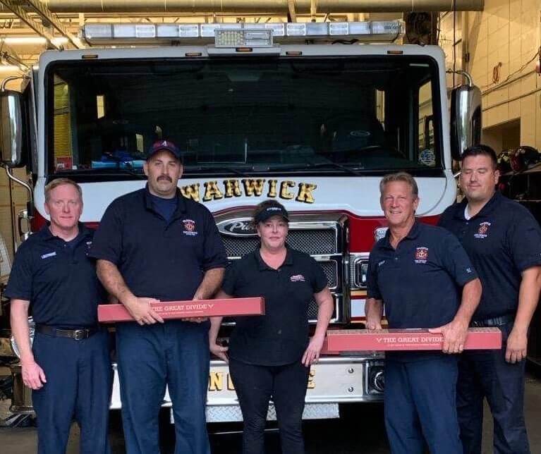 [CREDIT: D'Angelo Sandwiches] Firefighters at Warwick's Fire Station 4, with D’Angelo employee Helena Dowling, on Sunday. Dowling delivered free sandwiches to the station Sept. 29.