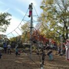 [CREDIT: Rob Borkowski] Children climb higher than was previously possible atop new playground equipment at the Salter Grove Park ribbon cutting Oct. 26.