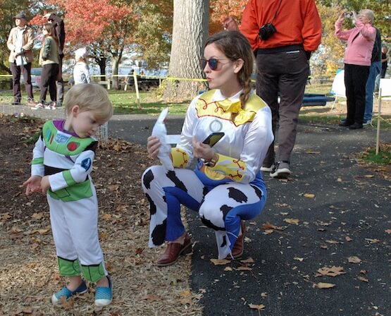  [CREDIT: Rob Borkowski] Angie Howard McParland and her son, Eamon, 3, costumed as Toy Story characters Jessie and Buzz Lightyear, at Salter Grove Park Oct. 26.