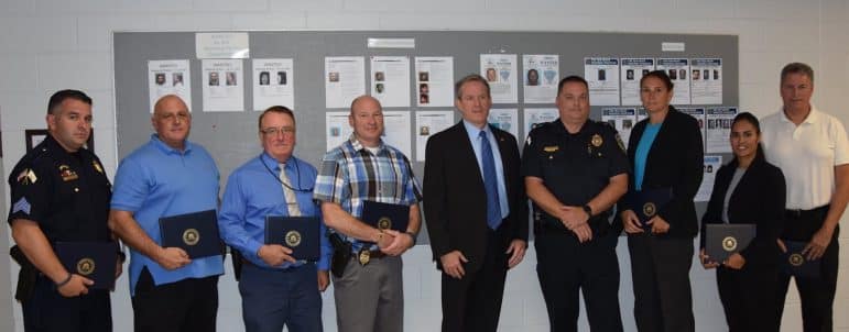 [CREDIT: WPD] The FBI's Resident Agent in Charge Rich Claflin and Special Agent Steve Medeiros presented certificates of appreciation to the members of the team that solved the murder Oct. 8. Pictured L-R: Sgt Matt Higgins, Sgt Mark Canning, Sgt Fred Pierce, Cpt Joe Hopkins, FBI RAC Rich Claflin, Col Rick Rathbun, Det Kerri Chatten, Det Gilda Fortier and criminalist Walt Williams.