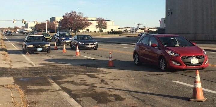 [CREDIT: Rob Borkowski] One land of Airport Road near the Post Road intersection was closed Monday as the Warwick Water Department repaired a water main.