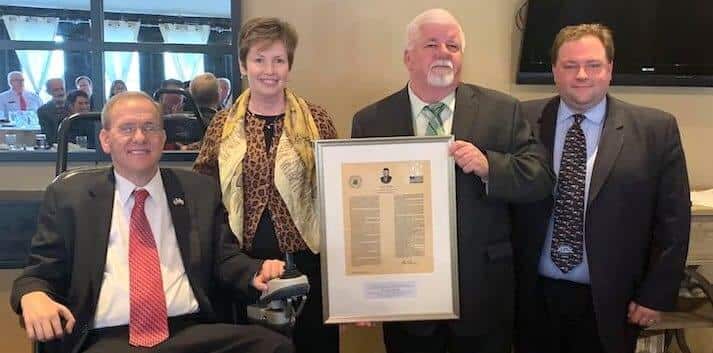 [CREDIT: Congressman Langevin's office] Nancy Beattie is presented with the Congressman John Joseph Moakley Award for Exemplary Public Service by Congressman Jim Langevin and representatives from the Greater Boston Federal Executive Board.
