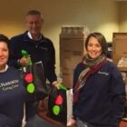 [CREDIT: BGCW] HarborOne volunteers played an important role by packing more than 200 bags of sides for each family aided by Stop&Shop donated turkeys.Pictured from left to right are HarborOne employees Maria Boyle, Steve Gibbons and Kathy Goulding.