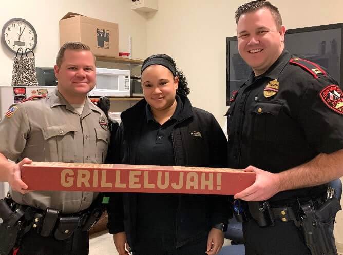 [CREDIT: D'Angelo] D'Angelo sandwich shops gifted several free sandwiches to Police departments throughout New England Oct. 29, including the West Warwick Police Department. Manager Tiffany Duchesneau is pictured here delivering the sandwiches to WWPD officers 