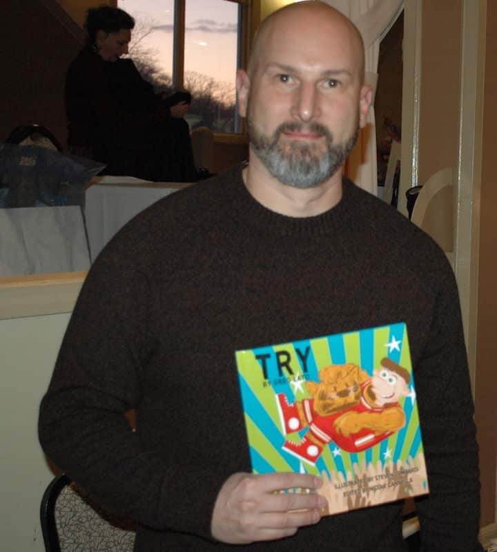 [CREDIT: Rob Borkowski] Children's author Greg Lato with his new book, TRY is an inspiring children's book with original song about not being discouraged to take a chance on your goals, at the RI Author Expo at Rhodes on the Pawtuxet.