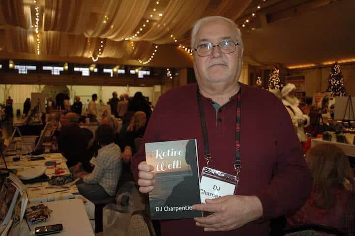 [CREDIT: Rob Borkowski] Warwick author DJ Charpentier with his book, 'Retire Well,' at the RI Author Expo at Rhodes on the Pawtuxet Dec. 7, 2019.