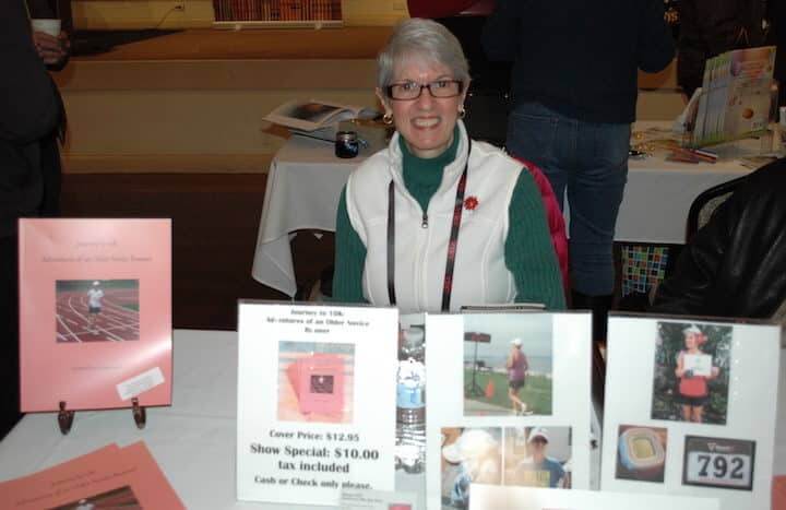 [CREDIT: Rob Borkowski] Connie Ross Ciampanelli, writer from North Providence, with her book, about running a 5K for the first time in her life at 60. at the 2019 RI Author Expo. 