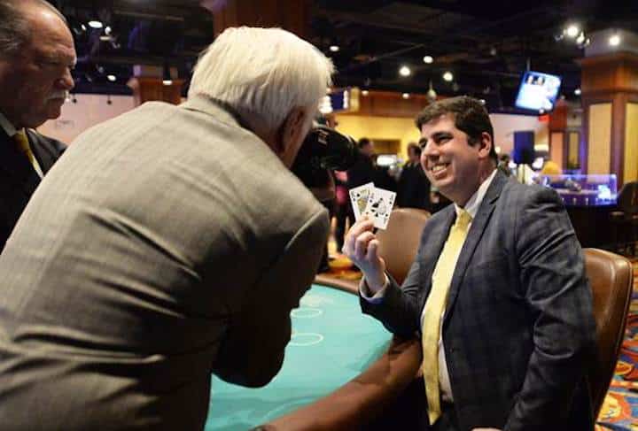 [CREDIT: LPPIB] Rep. Joseph J. Solomon Jr. holds up a winning hand at Twin River Casino in Lincoln on Thursday during the seventh annual Holiday Blackjack Tournament for Charity. Representative Solomon won $7,500 for Volunteers of Warwick Schools.