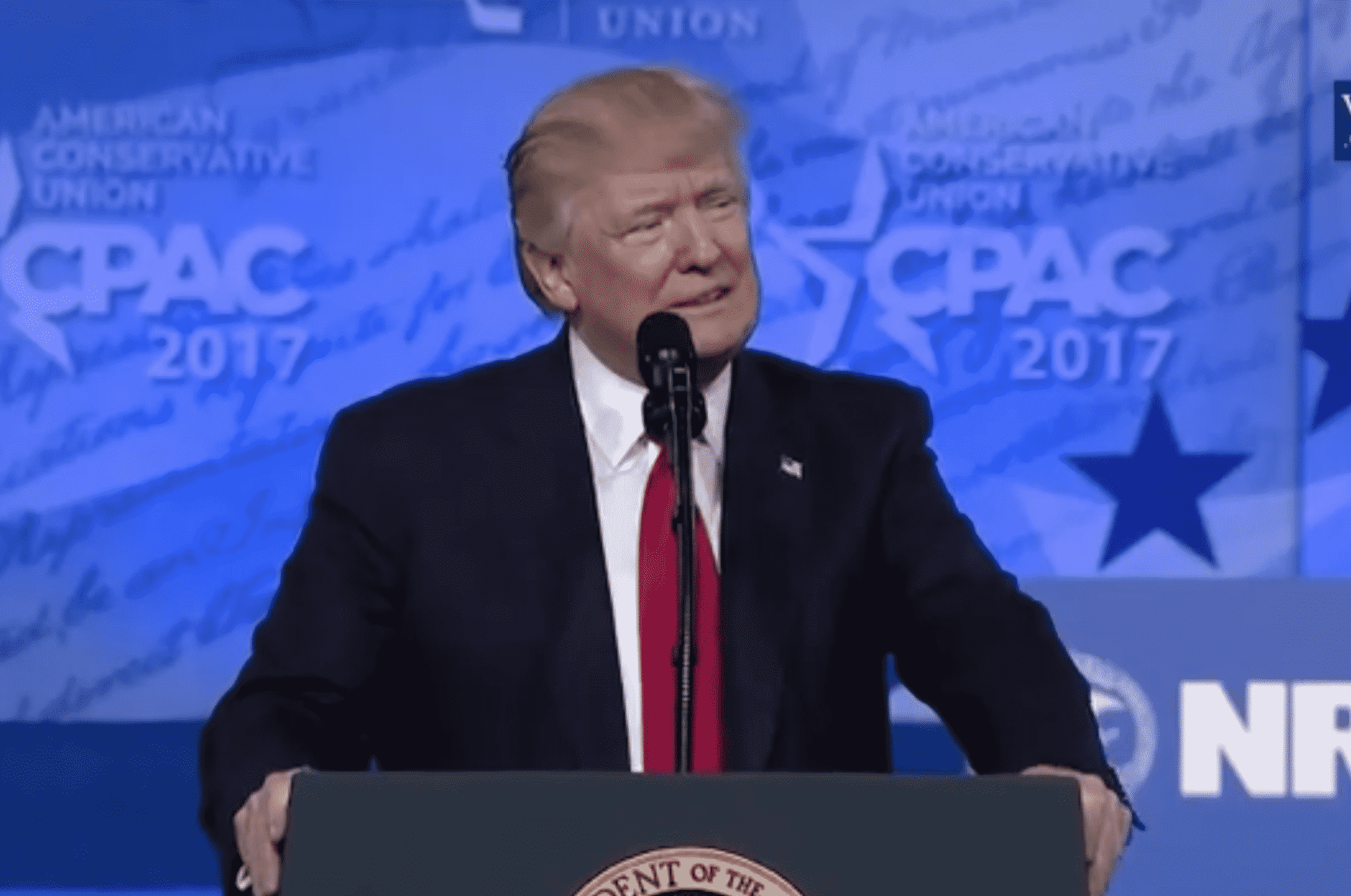[CREDIT: White House] President Donald Trump delivers remarks at the Conservative Political Action Conference (CPAC). Trump has been delaying using the DPA to provide supplies in the COVID-19 fight.