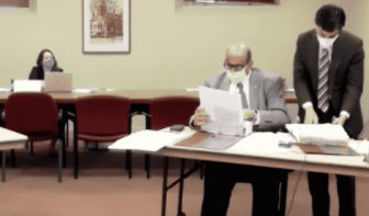 [CREDIT: City of Warwick] From left, Michael D’Amico, finance consultant, and Mayor Joseph J. Solomon search the budget in search of the answer to a budget question May 27 during budget hearings. The night was noteworthy for several questions the Mayor did not answer.