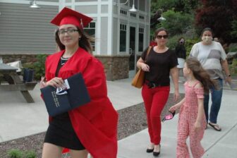 [CREDIT: Rob Borkowski] Tollgate 2020 graduate Megan Devlin walks from Toll Gate High with her family and diploma.