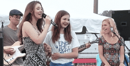 [CREDIT: Megan Harney] Megan Harney and Lexi Coons on stage together at the 2015 Coventry Relay for Life. A virtual Relay for Life will be held Aug. 22 at noon.