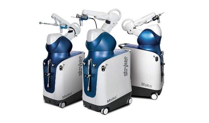 [CREDIT: stryker.com] A trio of Mako robotic arm surgical assistance tools.