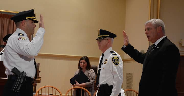 [CREDIT: Rob Borkowski] Maj. Brad Connor, recently promoted, was honored for achieving the rank in April 2017. At right, former WPD Chief Col. Stephen McCartney stands with former Mayor Scott Avedisian to formalize the promotion. Connor has been named the next WPD Chief by incoming Mayor Frank Picozzi.