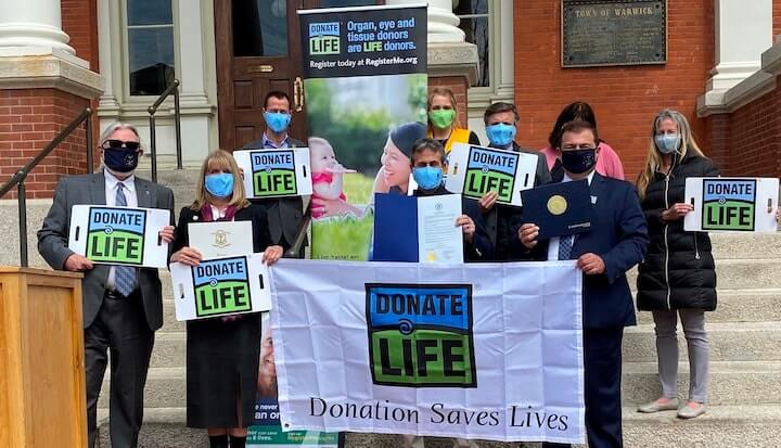 [CREDIT: New England Donor Services] Mayor Frank Picozzi met outside Warwick City Hall with people whose lives have been touched by organ donation Wednesday.