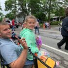 [CREDIT: Rob Borkowski] Kevin McCarthy and his daughter, Asliyna Sollitto,6, watch the 2021 Gaspee Day Parade Saturday, June 12.