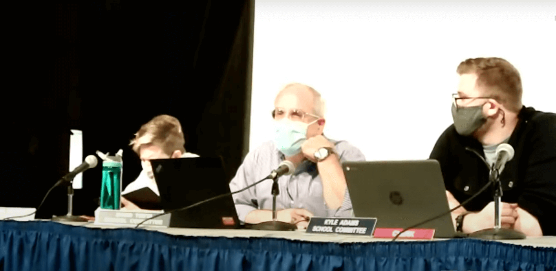 {CREDIT: WSC] From left, School Committee members Karen Bachus, David Testa and Kyle Adams at the Aug. 19 Warwick School Committee meeting. A health policy adopted at the meeting includes a school mask mandate.