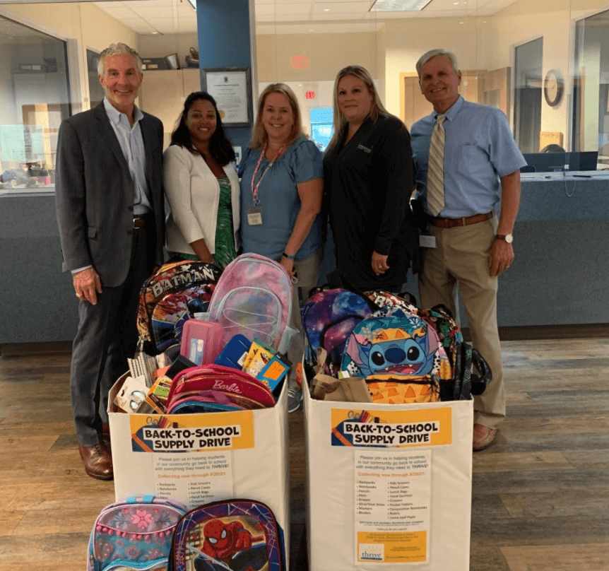 [CREDIT: Thrive] Greenwood Credit Union donates school supplies collected from its staff and members to Thrive’s Back-To-School Supply Drive benefitting students in the Youth & Family Program, Eleanor Briggs School and Hillsgrove Clubhouse Program. Pictured from left, Fred Reinhardt, President & CEO of Greenwood Credit Union and Board Member of Thrive Behavioral Health; Elaine Medina, Human Resources Administrator, Greenwood Credit Union; Laura Scussel, Program Manager, Thrive Youth & Family Services; Joclyn Clemm, Assistant Branch Manager, Greenwood Credit Union; and Dan Kubas-Meyer, Thrive’s President & CEO. 