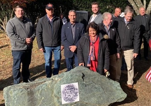 [CREDIT: Kim Wineman] From left, Council President Stephen McAllister, Councilman Ed Ladouceur, Mayor Frank Picozzi, Councilwoman Donna Travis, Councilman Jeremy Rix, Councilman James McElroy, and William Foley with the newly adorned Cold War memorial at Warwick Veterans Memorial Park.