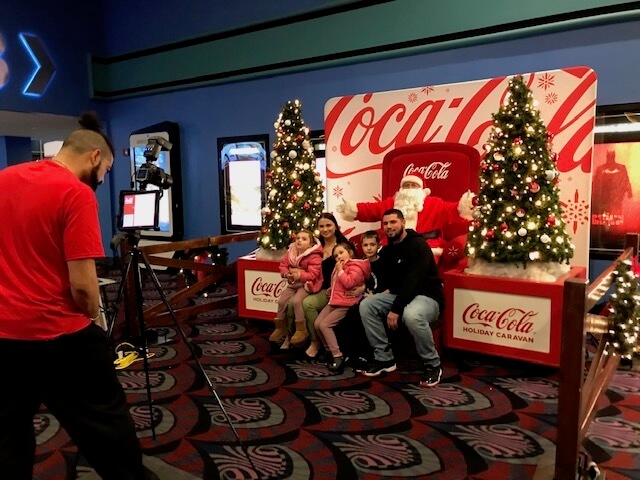 [CREDIT: Mary Carlos] The Coca-Cola Caravan visited Showcase Cinemas on Quaker Lane Thursday, offering free photos with Santa.