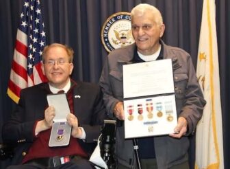 [CREDIT: Congress Jim Langevin's office] Tony Mazza received the Purple Heart, earned during the Korean War, from Congressman Jim Langevin Friday.
