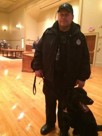 [CREDIT: Rob Borkowski] Ptlm. Paul Wells and his partner, K9 Fox, at City Hall prior to the April 7, 2015 ‪‎Warwick‬ City Council meeting. The meeting was a continuation of that Monday’s meeting, which a bomb threat ended prematurely.