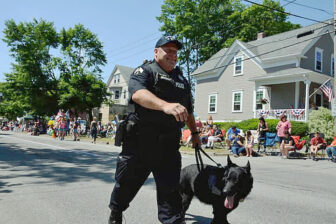 [CREDIT: Rob Borkowski] Ptlm. Paul Wells and his partner, K9 Fox, at the start of the 2017 Gaspee Day Parade.