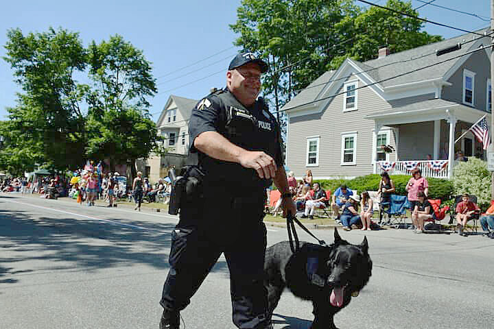 [CREDIT: Rob Borkowski] Ptlm. Paul Wells and his partner, K9 Fox, at the start of the 2017 Gaspee Day Parade.