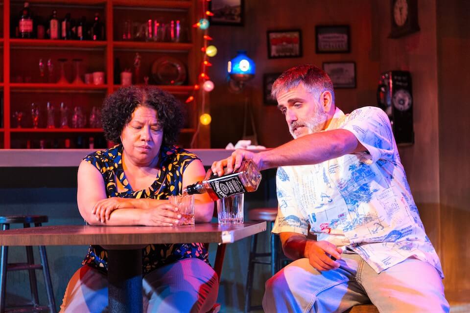 [CREDIT: The Gamm] Lynn Nottage’s Pulitzer Prize- winning “Sweat” runs at The Gamm Nov. 3 - 27. Above, Stan, played by Steve Kidd, pours a drink for Cynthia, played by Kim Gomez.