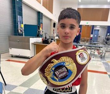 [CREDIT: Henry Emery] Rocco Emery, a sixth-grader at Winman Middle School, is the New England Silver Gloves Champ after his Dec. 11 win in Lynn, MA.