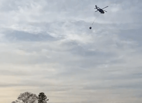 [CREDIT: RI Breaking News Service] The RI National Guard used helicopters to help crews fight an Exeter brush fire Friday.
