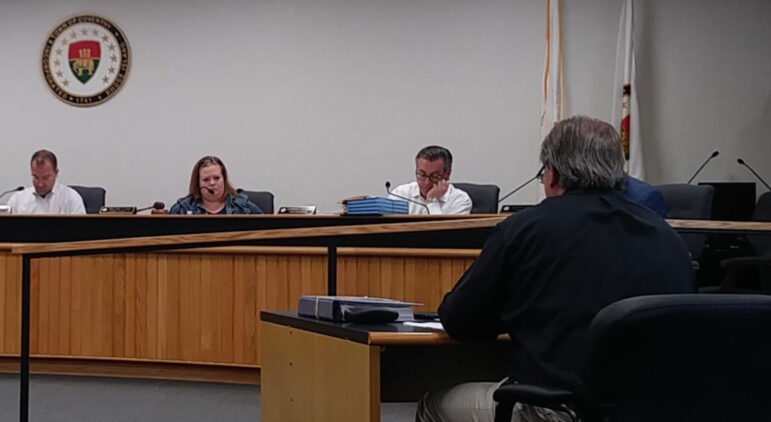 [CREDIT: Joe Hutnak] Coventry town councilors review the FY24 budget resolution with Finance Director Robert Civetti, right.
