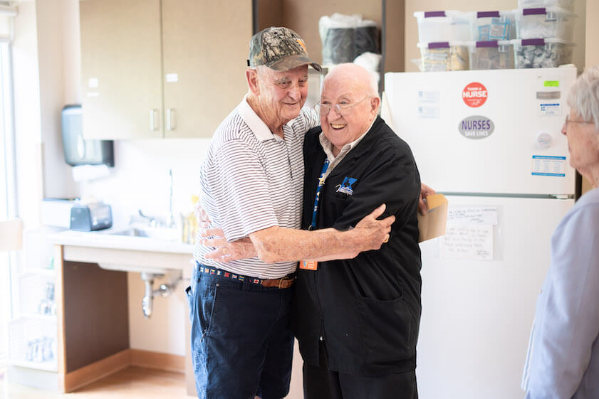 [CREDIT: Kent Hospital] From left, Retired Foster, RI Police Chief John Murray and Al Stanford, volunteer at Kent Hospital's infusion center, where he comforted Murray and his wife. The couple surprised Stanford July 14, 2023.