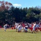 [CREDIT: Joe Hutnak] Coventry's offense lines up for the snap against West Warwick during the CoventryThanksgiving Day game at Coventry High School.