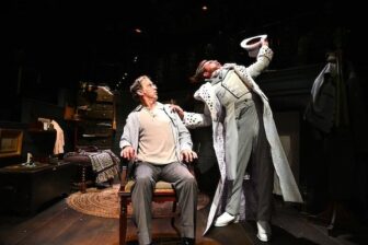 [CREDIT: Trinity Rep] From left,Mauro Hantman as Ebenezer Scrooge is haunted by Jeff Church as Ghost of Christmas Past in Trinity Repretory Comany's "A Christmaas Carol.