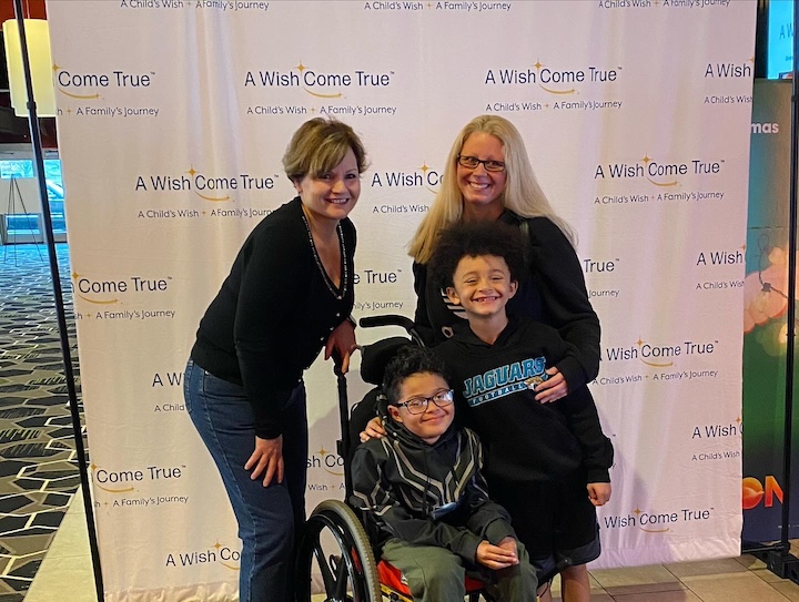 [CREDIT: A Wish Come True] A Wish Come True hosted 185 "Wish Kids" and their families to see the movie Disney's "Wish". Dec. 3 at Showcase Cinema De Lux. Above, at the event, A Wish Come True Executive Director Mary-Kate O'Leary is with Erica Thompson, Bryon and Isaiah Hazzard.