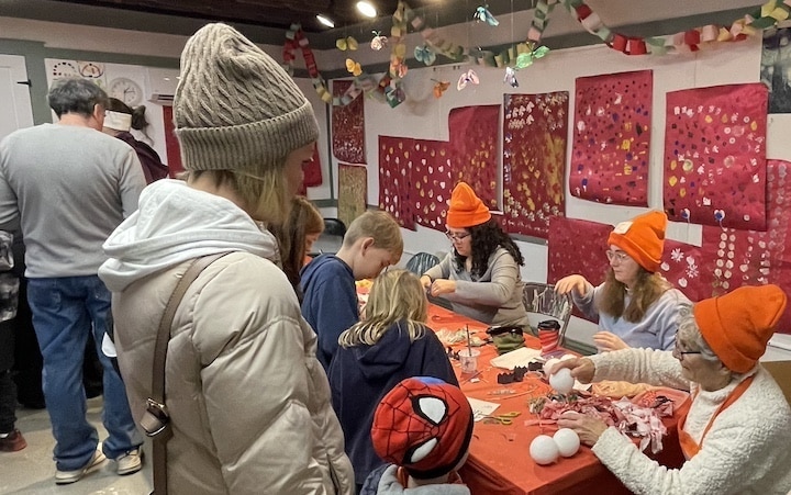 [CREDIT: Rob Borkowski] Inside the Warwick Center for the Arts, Mollie Daniels and Deborah Silvano were leading arts and crafts during the Apponaug Winter Festival.