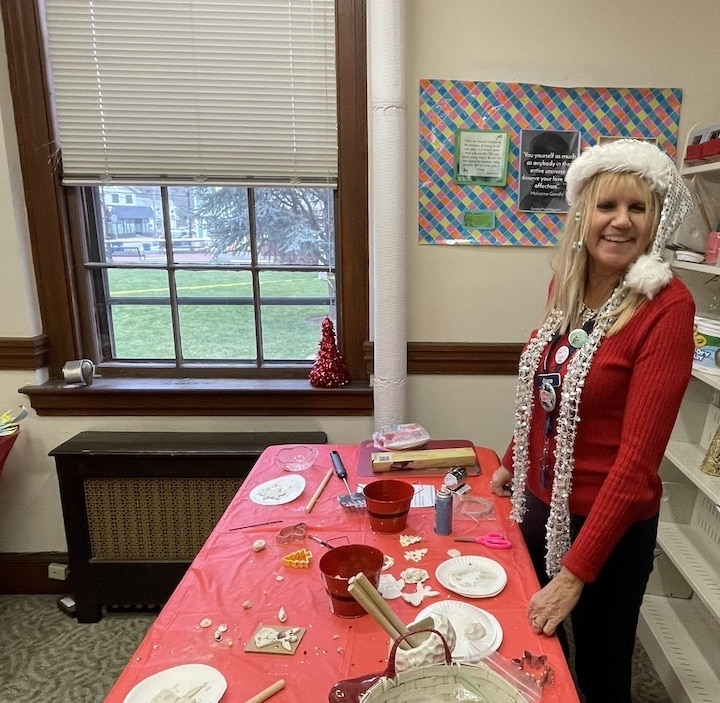 [CREDIT: Rob Borkowski] Inside the Apponaug Branch Warwick Public Library, Apponaug Branch Supervisor Diane Iacono was leading arts and crafts during the Apponaug Winter Festival.