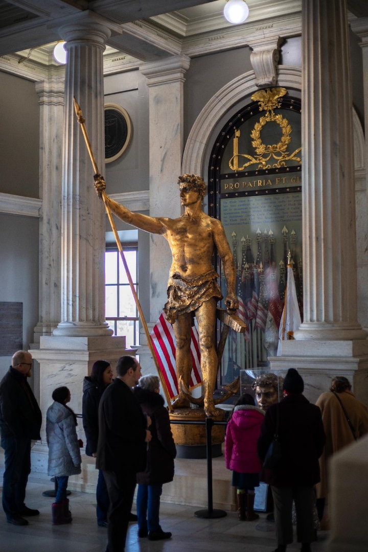 [CREDIT: Gov. Dan McKee's Office] The  Independent Man statue will spend another few days in the State House main entrance before moving to Rhode Island National Guard’s North Main Street Armory in Providence.