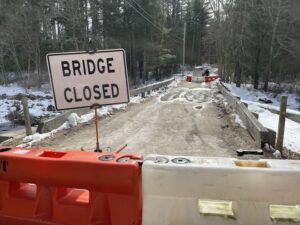 [CREDIT: Rob Borkowski] Cahoone Road Bridge, closed to traffic due to erosion from heavy rains in January. The bridge is scheduled for repair in 2026. A RIDOT van was parked on the opposite side, with three men working under it on Feb. 22, 2024.