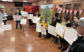 [CREDIT: Rob Borkowski] Several parents rallied outside the Coventry High Auditorium Monday night ahead of the Coventy School Committee meeting reviewing a Coventry Schools Restructure plan.