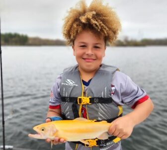 [CREDIT: Len Baker] The 2024 - 2025 Rhode Island Freshwater Fishing Regulation Guide cover photo contest winner, Broc B.  With trout season open April 13, DEM will be ready after stocking more than 100 freshwater spots, including children’s-only ponds with 60,000 fish. 