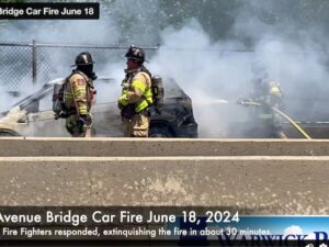 [CREDIT: Rob Borkowski] A car fire on the East Avenue bridge held up traffic in the west lane of the street June 18 at noon.